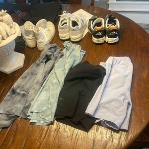 A bundle of men’s clothing items and shoes